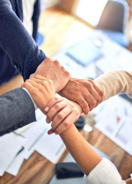 person in black long sleeve shirt holding persons hand